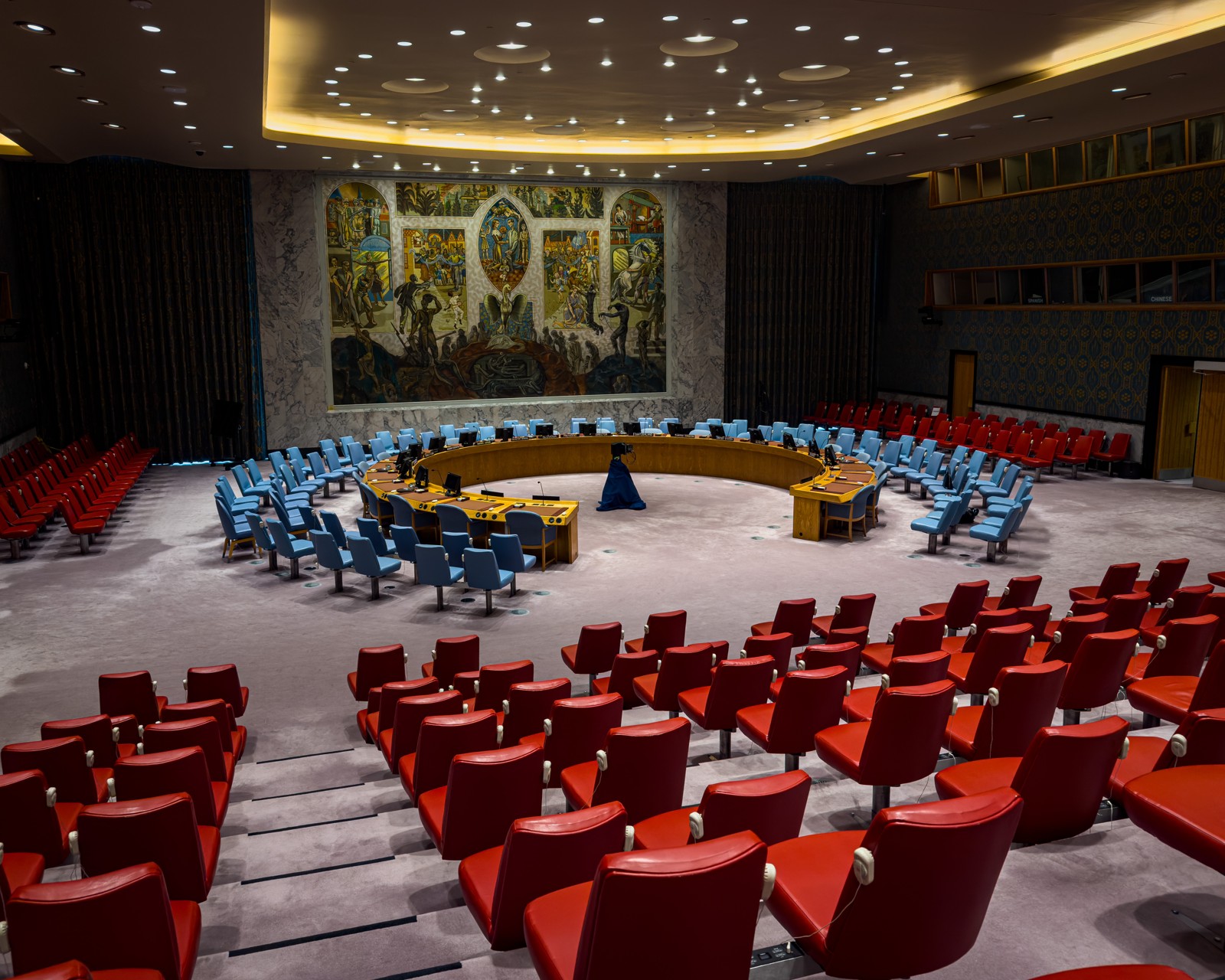 The UN Security Council chamber, with its circular table and mural
